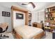 Bedroom with a built-in murphy bed and shelving, perfect for a home office at 20615 N 105Th Ave, Peoria, AZ 85382