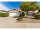 Single Gathering home with a well-maintained lawn, beautiful desert landscaping and a two-car garage at 20615 N 105Th Ave, Peoria, AZ 85382