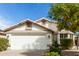Charming home featuring a two-car garage, tile roof, and manicured landscaping at 20615 N 105Th Ave, Peoria, AZ 85382
