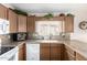 Close up of the kitchen featuring granite countertops and wooden cabinets at 20615 N 105Th Ave, Peoria, AZ 85382