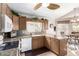 Spacious kitchen featuring granite countertops, wooden cabinets, and modern appliances at 20615 N 105Th Ave, Peoria, AZ 85382