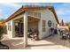 Covered patio with comfortable seating, ideal for outdoor relaxation and entertaining at 20615 N 105Th Ave, Peoria, AZ 85382