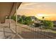 Balcony view of fenced backyard featuring swimming pool and mountain views in distance at 2231 E Orangewood Ave, Phoenix, AZ 85020