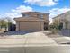 Charming two-story home featuring a tile roof, large driveway and a two-car garage at 22359 W Desert Bloom St, Buckeye, AZ 85326