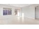 Bright living room featuring tile flooring, recessed lighting, and sliding glass door access to the outdoor space at 24710 N 169Th Ave, Surprise, AZ 85387