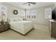 Bedroom featuring plantation shutters and neutral decor at 2477 W Market Pl # 18, Chandler, AZ 85248