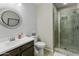 Well-designed bathroom with a modern sink, decorative mirror, toilet, and tiled glass-enclosed shower at 2477 W Market Pl # 18, Chandler, AZ 85248