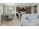 Cozy living room blending into dining and kitchen spaces with a large sectional sofa at 2477 W Market Pl # 18, Chandler, AZ 85248