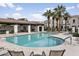 Enjoy the community pool with plenty of seating and beautiful palm trees at 2477 W Market Pl # 18, Chandler, AZ 85248