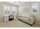 Bright room that features a desk, chair, and sofa area at 2477 W Market Pl # 18, Chandler, AZ 85248