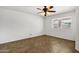 Cozy bedroom featuring tile floors and a view of the green backyard at 2561 E Toledo Ct, Gilbert, AZ 85295