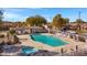 Aerial view of the neighborhood community pool and jacuzzi surrounded by lounge chairs at 2561 E Toledo Ct, Gilbert, AZ 85295