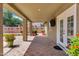 Inviting covered patio area with tiled flooring and outdoor access at 2561 E Toledo Ct, Gilbert, AZ 85295