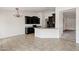 Open kitchen with dark cabinets, granite counters, and a view into the next room at 2561 E Toledo Ct, Gilbert, AZ 85295