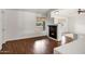 Open-concept living area with a cozy fireplace and hardwood flooring at 2561 E Toledo Ct, Gilbert, AZ 85295