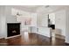 Open-concept living area with a cozy fireplace and hardwood flooring at 2561 E Toledo Ct, Gilbert, AZ 85295