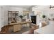 Open-concept living area with a cozy fireplace perfect for working from home at 2561 E Toledo Ct, Gilbert, AZ 85295