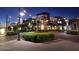 Night scene of the shopping center street with decorative lights and building views at 2561 E Toledo Ct, Gilbert, AZ 85295