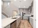 Modern kitchen boasts stainless steel appliances, gray cabinetry, subway tile backsplash, and an island sink at 25916 N 161St Ave, Surprise, AZ 85387