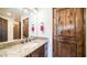 Bathroom vanity features granite counters, bronze fixtures, and decorative lighting at 3168 S Yaqui Ln, Gold Canyon, AZ 85118