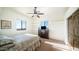 Cozy bedroom with neutral tones, plush carpet, and ample natural light from two windows at 3168 S Yaqui Ln, Gold Canyon, AZ 85118