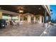 Expansive covered patio with ceiling fan, tile flooring and outdoor seating areas at 3168 S Yaqui Ln, Gold Canyon, AZ 85118