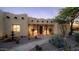 Southwestern home with fountain, desert landscaping, and wood beam accents at 3168 S Yaqui Ln, Gold Canyon, AZ 85118