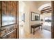 Hallway showcasing tile floors with a view to soaking tub and scenic mountain views at 3168 S Yaqui Ln, Gold Canyon, AZ 85118