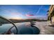 Amazing sunset view of the infinity pool with colorful skies at 3168 S Yaqui Ln, Gold Canyon, AZ 85118