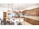 Well-equipped kitchen with granite countertops, stainless steel appliances, and ample wood cabinetry at 3168 S Yaqui Ln, Gold Canyon, AZ 85118