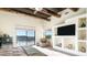 Bright main bedroom featuring wood beam ceiling, scenic views and built-in shelving at 3168 S Yaqui Ln, Gold Canyon, AZ 85118
