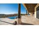 Spacious outdoor patio area featuring an infinity pool and gorgeous mountain views at 3168 S Yaqui Ln, Gold Canyon, AZ 85118
