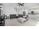 Bright open living room with tile floors, ceiling fan, and gray sectional sofa at 3193 E Rebel E Ln, San Tan Valley, AZ 85143