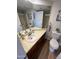 Bathroom with wood floor, vanity with sink, toilet, and shower at 3228 W Glendale Ave # 103, Phoenix, AZ 85051