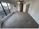 Bedroom featuring large window allowing natural light into carpeted area at 3228 W Glendale Ave # 103, Phoenix, AZ 85051