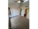 Carpeted bedroom featuring a closet and adjoining bathroom at 3228 W Glendale Ave # 103, Phoenix, AZ 85051