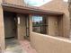 Charming condo featuring a private entrance, large window, and stucco walls at 3228 W Glendale Ave # 103, Phoenix, AZ 85051