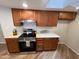 Modern kitchen featuring sleek appliances, ample cabinet space, and efficient lighting at 3228 W Glendale Ave # 103, Phoenix, AZ 85051