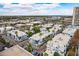 Aerial view of a townhome community with palm trees and city buildings in the background at 3633 N 3Rd Ave # 2016, Phoenix, AZ 85013