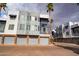 Modern townhome exterior featuring a two-car garage and contemporary architectural design at 3633 N 3Rd Ave # 2016, Phoenix, AZ 85013
