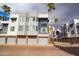Contemporary townhome exterior with a two-car garage, modern architecture, and palm trees at 3633 N 3Rd Ave # 2016, Phoenix, AZ 85013