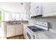 Well-lit kitchen with marble countertops, white cabinets, and modern appliances at 3633 N 3Rd Ave # 2016, Phoenix, AZ 85013
