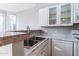 Functional kitchen with stainless steel sink, granite countertops and modern white appliances at 3633 N 3Rd Ave # 2016, Phoenix, AZ 85013