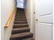 Carpeted staircase with wooden handrail leading to the upper level at 3633 N 3Rd Ave # 2016, Phoenix, AZ 85013