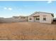 Backyard features a stucco wall and plenty of space at 36986 W Prado St, Maricopa, AZ 85138
