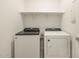 Neat laundry room featuring a side-by-side washer and dryer, plus a shelf at 36986 W Prado St, Maricopa, AZ 85138