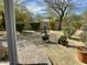 Landscaped backyard with decorative shrubbery and a charming fire pit at 4116 E Sierra Sunset Trl, Cave Creek, AZ 85331