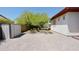 Private backyard featuring a spacious brick-paved patio, mature trees, and a storage shed at 4116 E Sierra Sunset Trl, Cave Creek, AZ 85331
