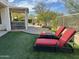 Relaxing backyard with lawn, desert landscape, and comfortable lounge chairs at 4116 E Sierra Sunset Trl, Cave Creek, AZ 85331