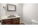 Charming powder room with a decorative sink, detailed mirror, and a toilet at 4116 E Sierra Sunset Trl, Cave Creek, AZ 85331